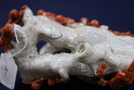 A Chinese chalcedony vase, in imitation of coral, H. 19.5cm, carved wood stand